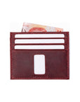 Red Ed Contemporary Crazy Horse leather card holder with white cards and Singapore banknote