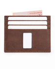 Rear of brown Ed Sleek 2 crazy horse leather minimalist wallet with white cards and a Singapore note