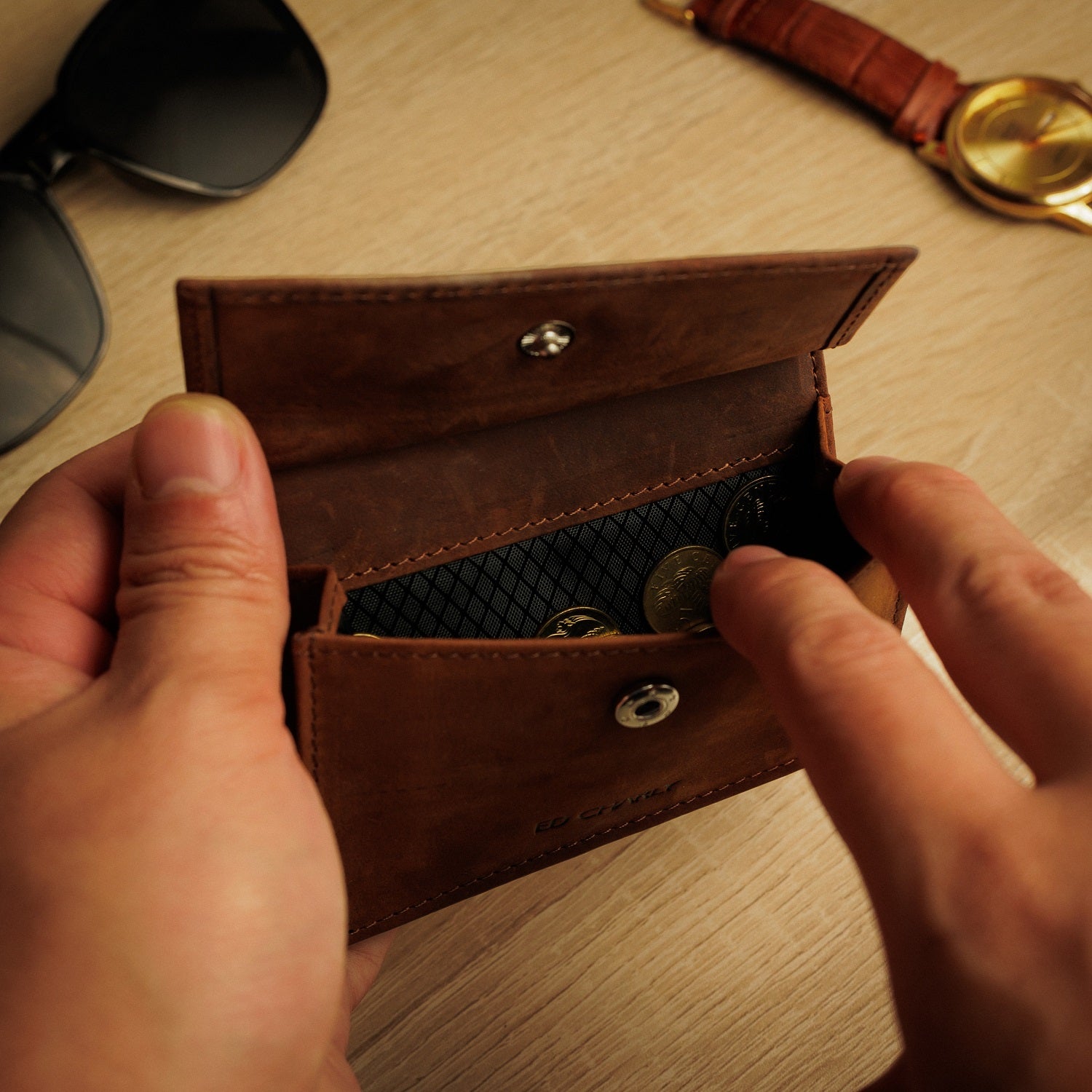 Open brown Ed Classic wallet showing coin compartments